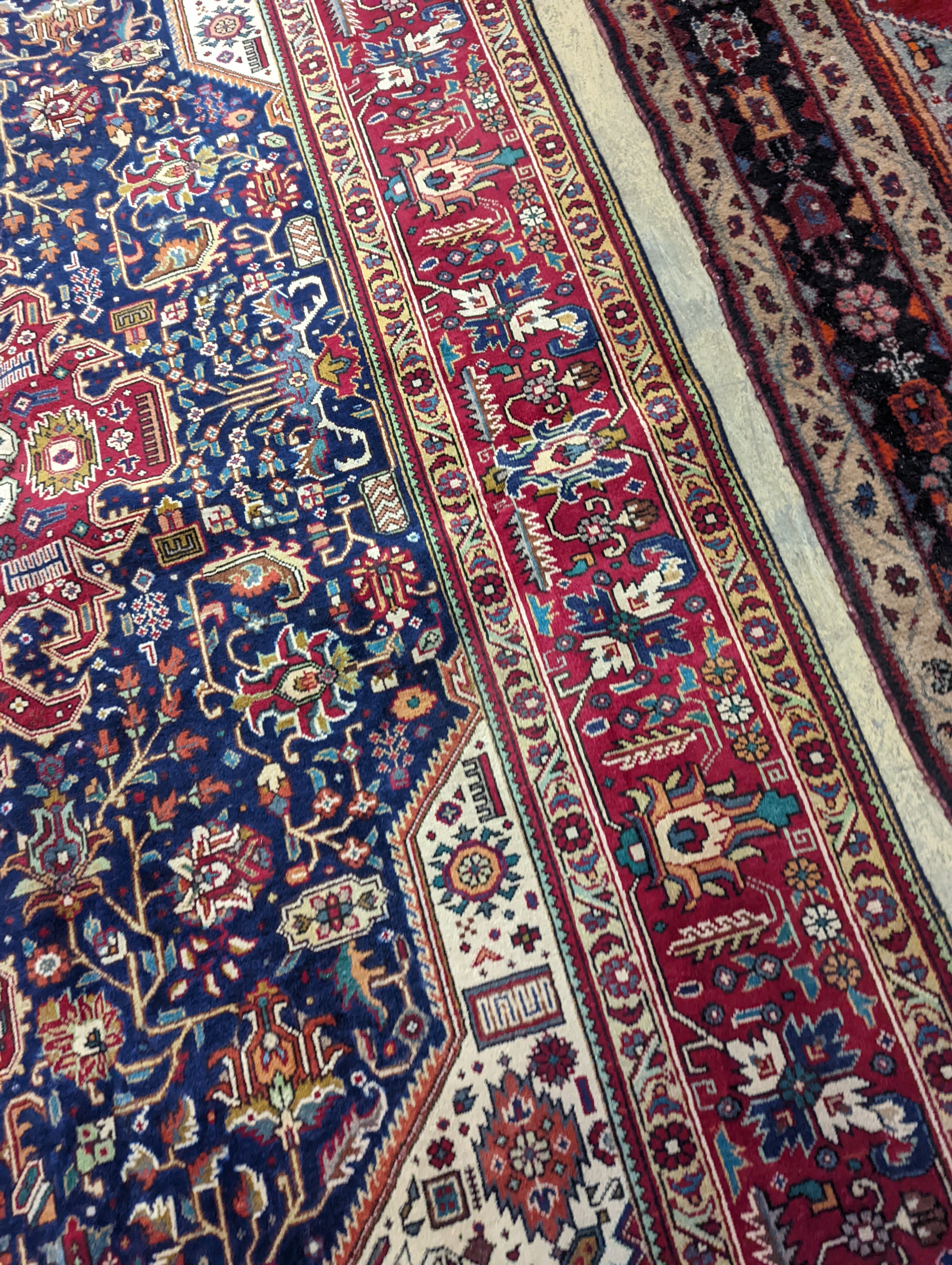 A Tabriz blue ground carpet, 290 x 200cm